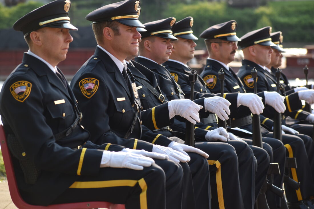 Members of the Wheeling Police Department Honor Guard sit at attention during the department's 10th Annual Law Enforcement Memorial ceremony Wednesday night at Heritage Port. (Photo by Eric Ayres)